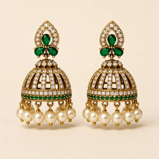 Gold-tone crystal cage jhumka earrings in Emerald Green with pearl-style drops