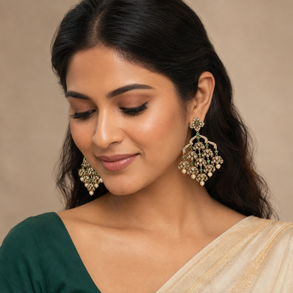 Model wearing emerald green crystal chandelier jhumka earrings