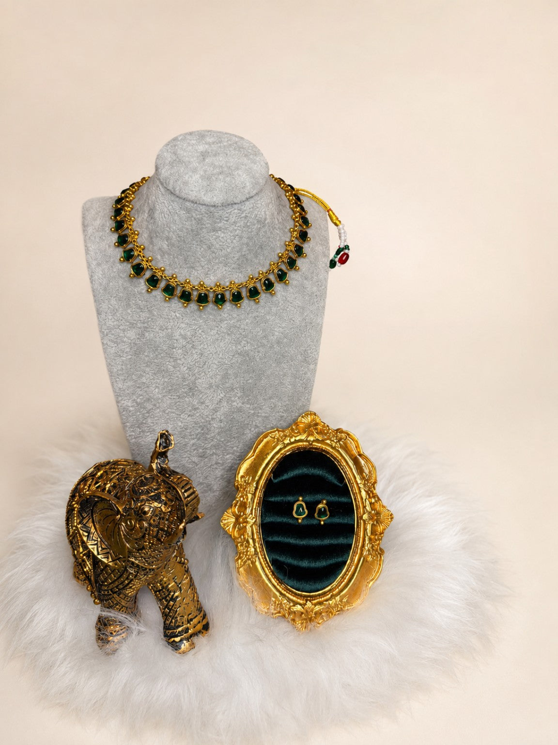 Emerald-green gemstone traditional necklace set with gold-tone design, featuring intricate craftsmanship and matching earrings.