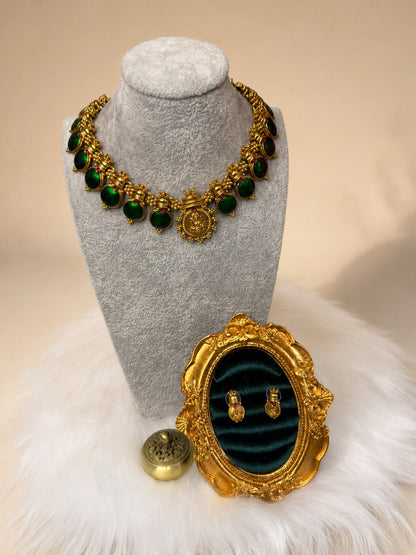 Emerald-green traditional medallion stone necklace set by Belumiee, featuring intricate designs and matching earrings.
