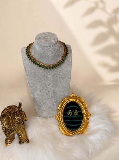 Gold-tone teardrop stone necklace set with emerald accents, traditional jewelry by Belumiee, featuring intricate design and elegant craftsmanship.
