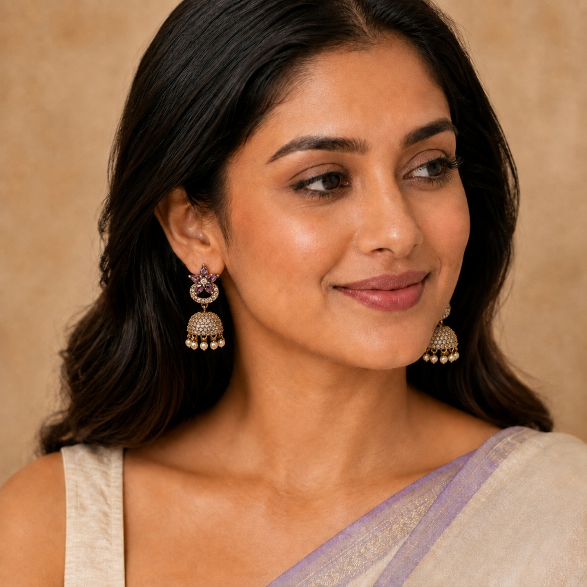 Model wearing amethyst purple floral crystal dome jhumka earrings