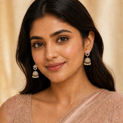 Model wearing blush pink floral crystal dome jhumka earrings