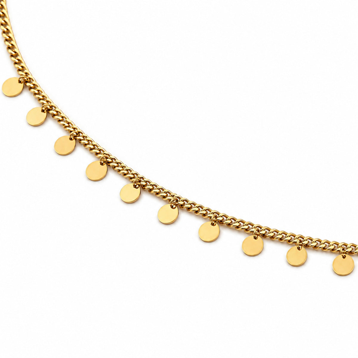Close-up of gold-tone hip chain with evenly spaced polished round disc charms