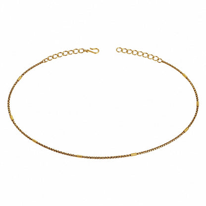 Adjustable gold-tone single-row hip chain with textured spacer accents on white background