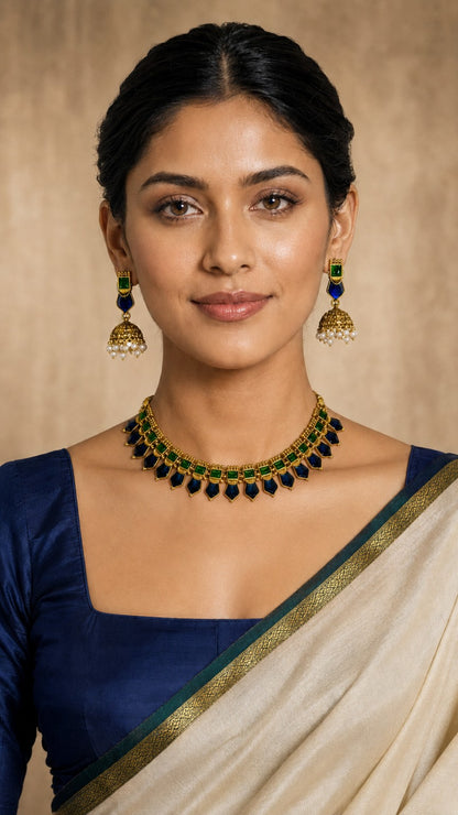 Emerald drop stone traditional necklace set with green-blue stones and intricate design, modeled on a woman.
