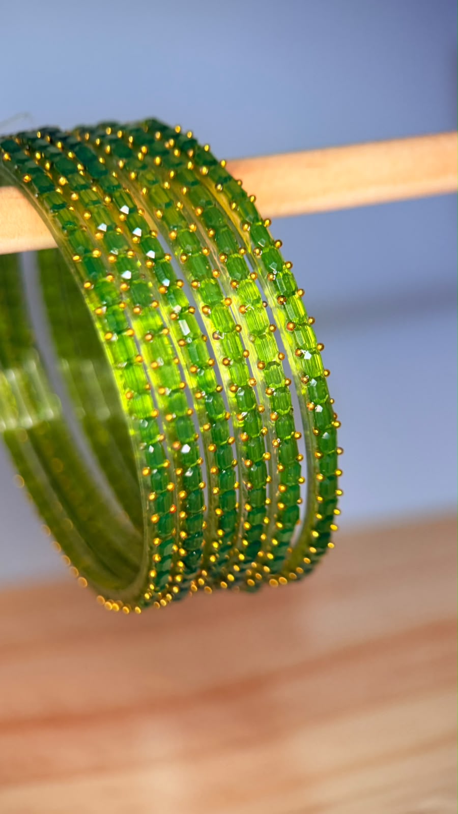 Lime green Navrang Sparkle Glass Bangles Set by Belumiee, featuring shimmering glass bangles with intricate designs.
