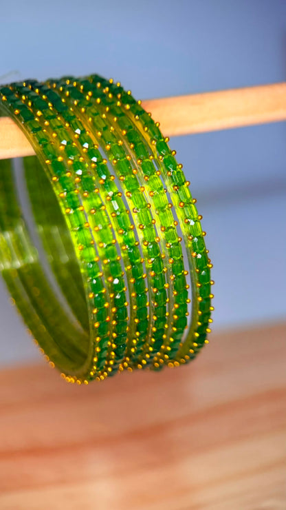 Lime green Navrang Sparkle Glass Bangles Set by Belumiee, featuring shimmering glass bangles with intricate designs.