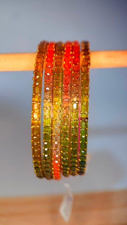 Belumiee Navrang Sparkle Glass Bangles set with peach blossom design, featuring shimmering glass bangles for festive occasions.