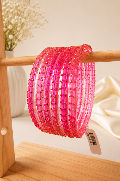 Peach pink Navrang Sparkle glass bangles set by Belumiee, featuring shiny, decorative bangles perfect for traditional jewelry.