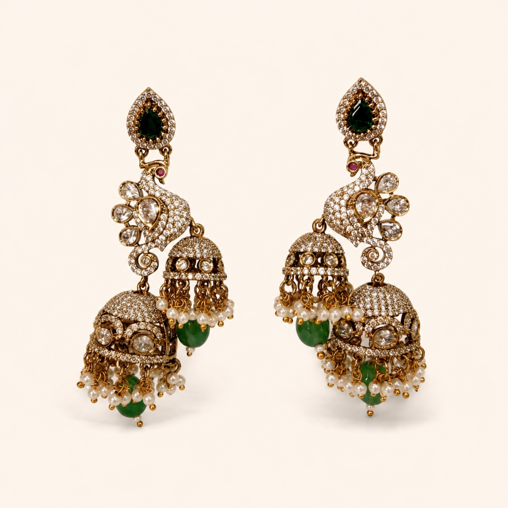 Antique gold peacock double jhumka earrings in Emerald Green with pearl-style drops
