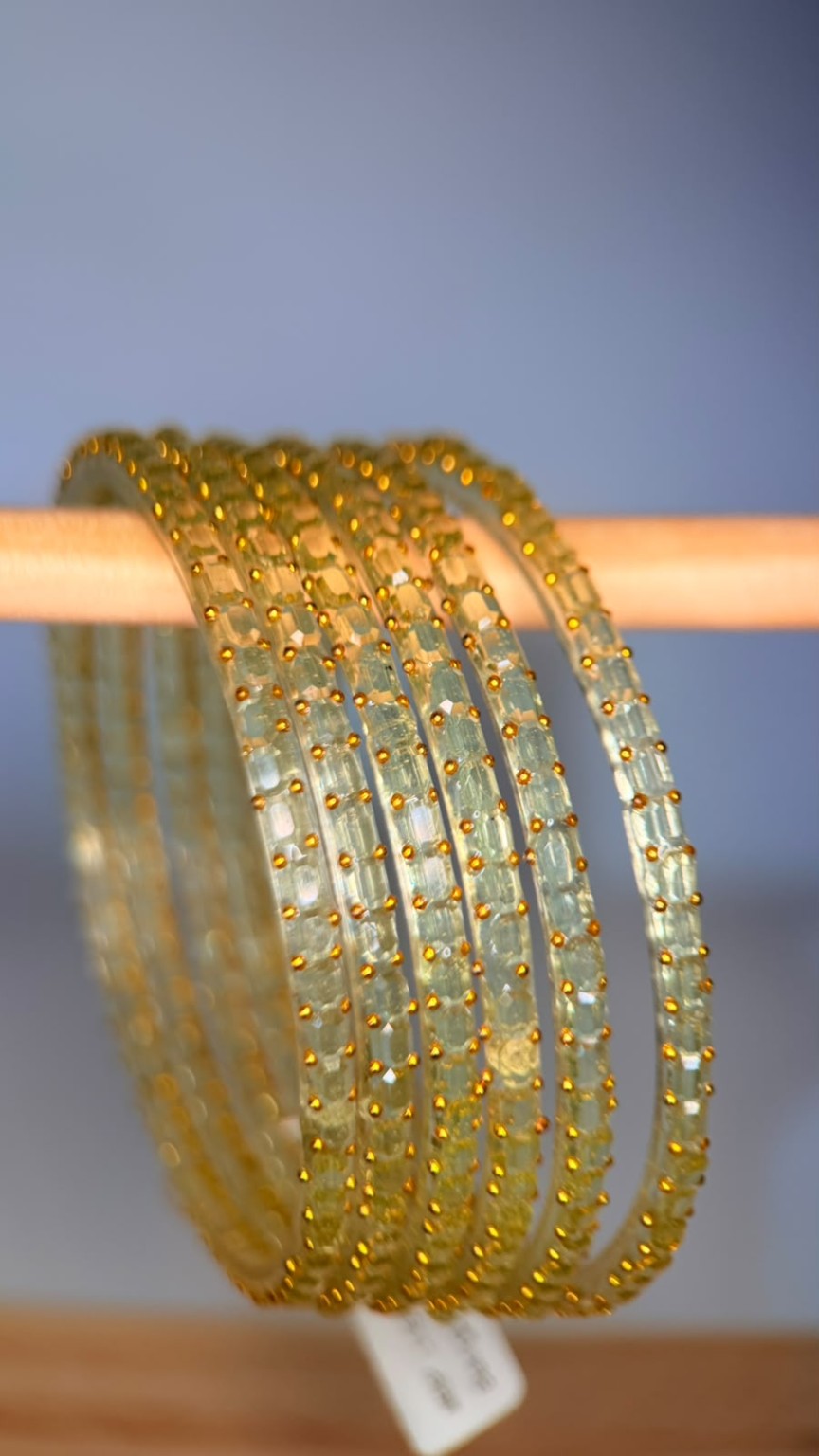 Belumiee Navrang Sparkle Glass Bangles set featuring pearl champagne-colored bangles with shimmering glass design.