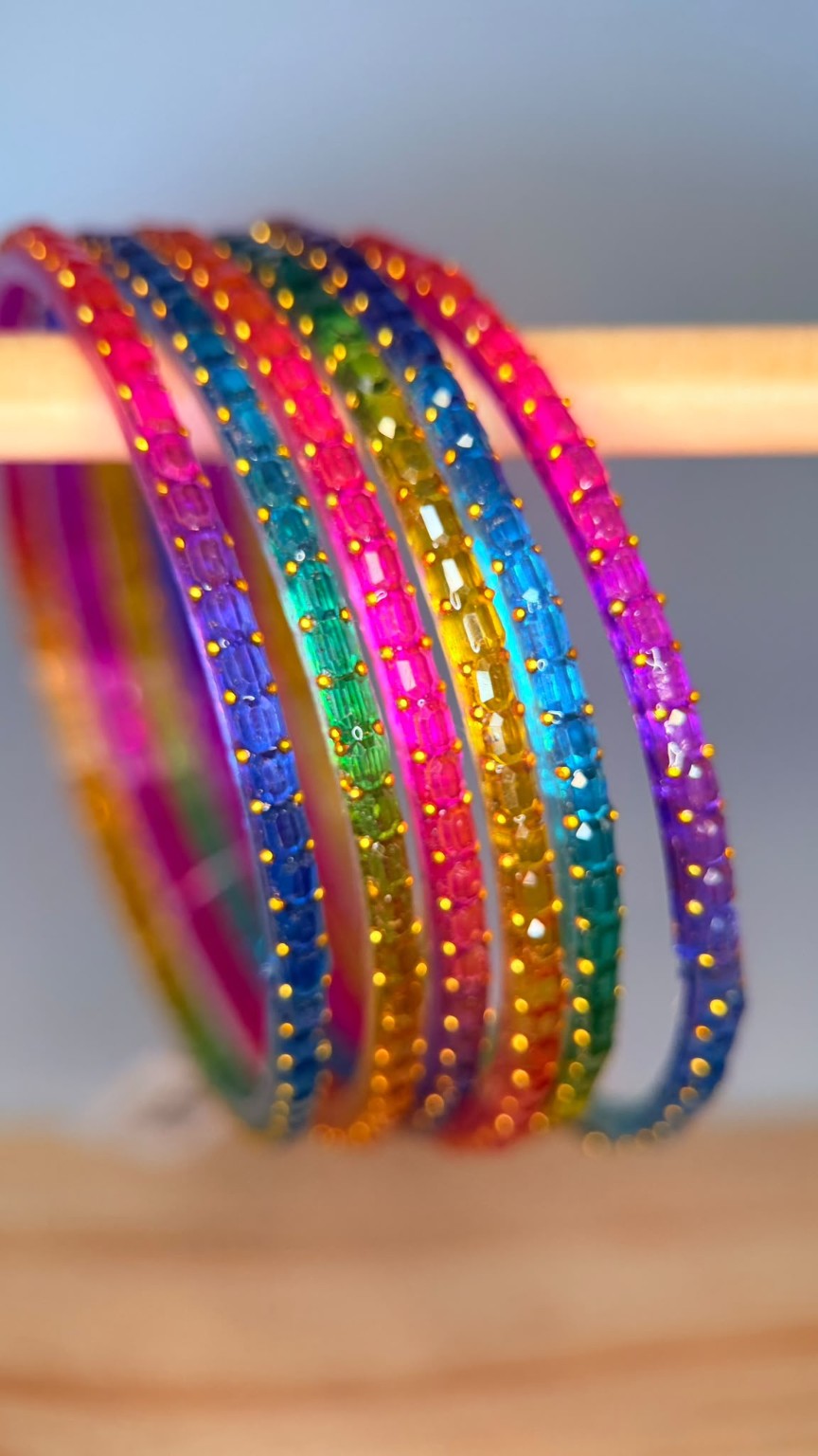 Belumiee Navrang Sparkle Glass Bangles Set featuring colorful rainbow glass bangles with shimmering, vibrant designs.