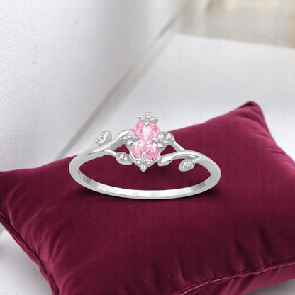 Sterling silver flower ring with pink marquise cubic zirconia by Belumiee, featuring a delicate floral design and sparkling gemstone.