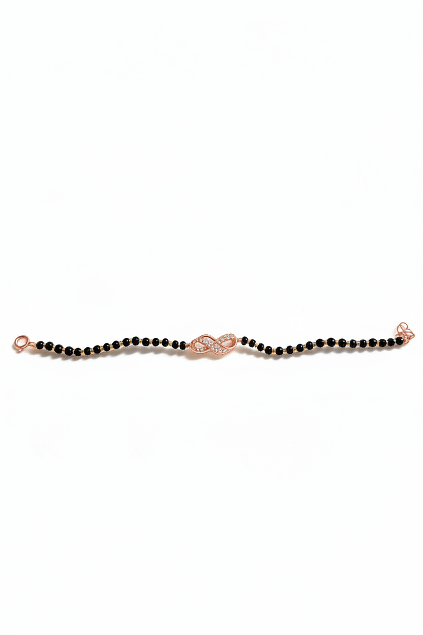 Sterling silver infinity charm bracelet with delicate chain and clasp, featuring a shiny infinity symbol charm.