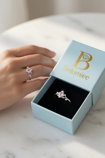 Sterling silver flower ring with pink marquise-shaped CZ gemstone, elegant jewelry accessory by Belumiee.