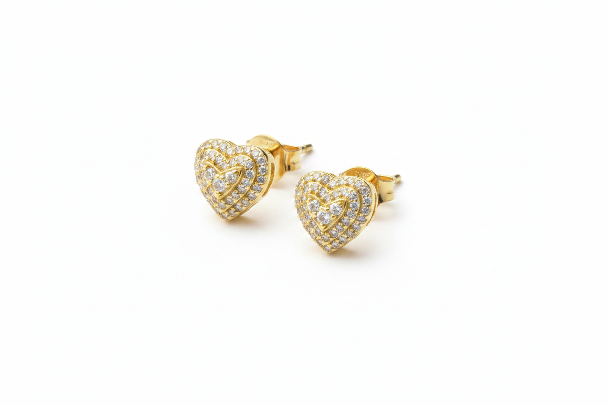 Sterling silver heart-shaped stud earrings by Belumiee, featuring polished 925 silver finish with a classic design.