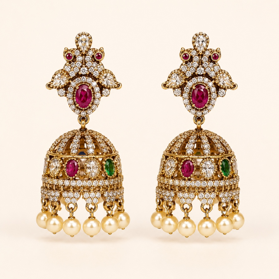 Gold-tone royal crystal dome jhumka earrings in Ruby and Emerald Green with pearl-style drops