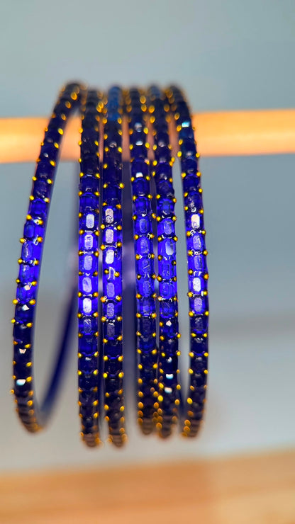 Royal blue Navrang Sparkle Glass Bangles Set by Belumiee, featuring shimmering glass bangles with intricate designs.