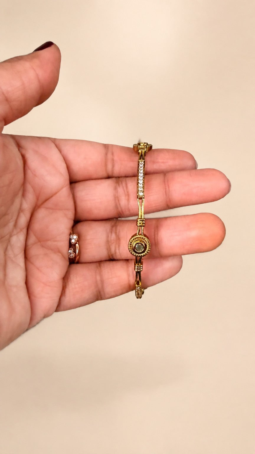 Green face of Ruby and Green crystal medallion gold-tone bangle