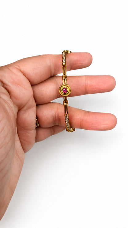 Ruby face of Ruby and Green crystal medallion gold-tone bangle