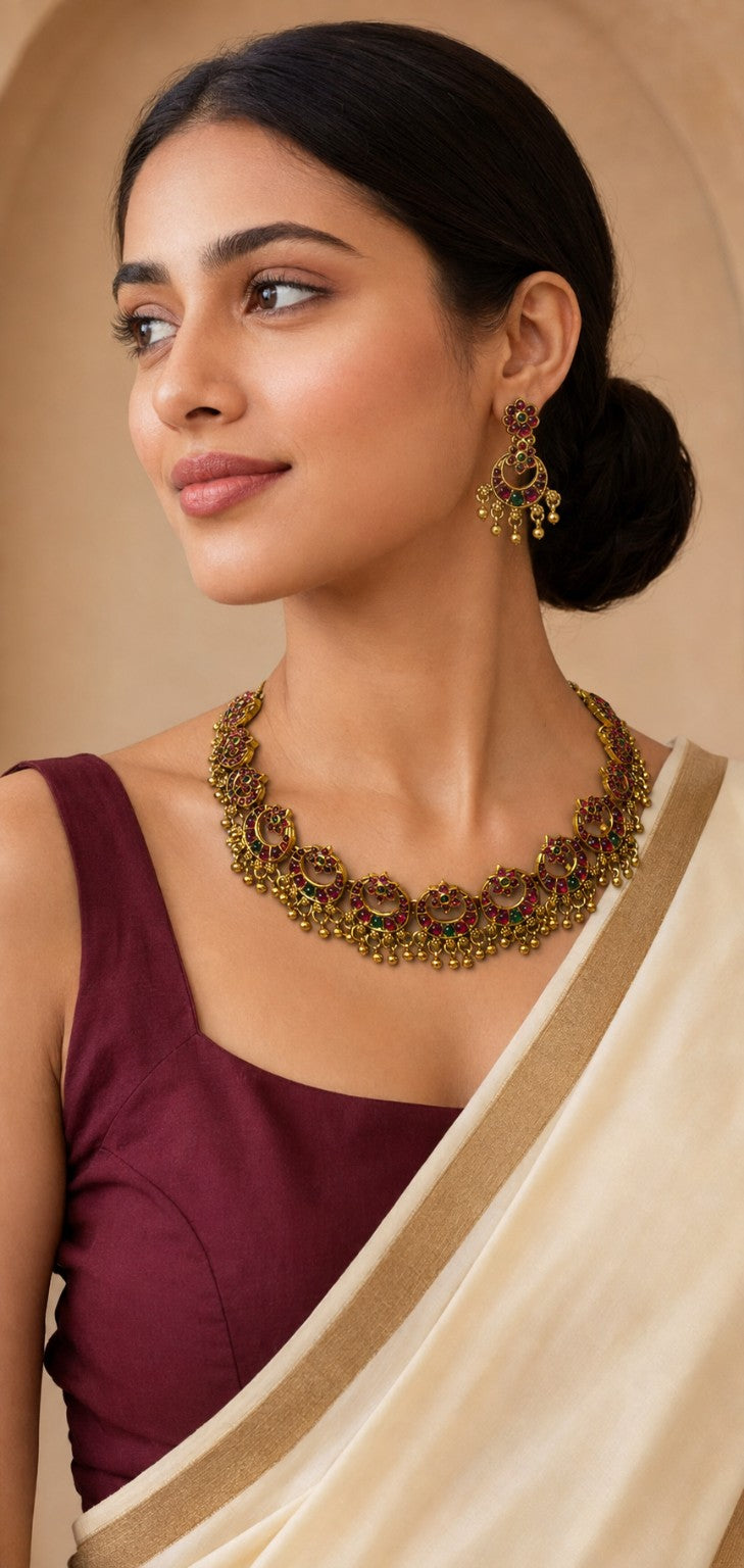 Ruby and green peacock choker necklace set by Belumiee featuring intricate design and vibrant gemstone details.