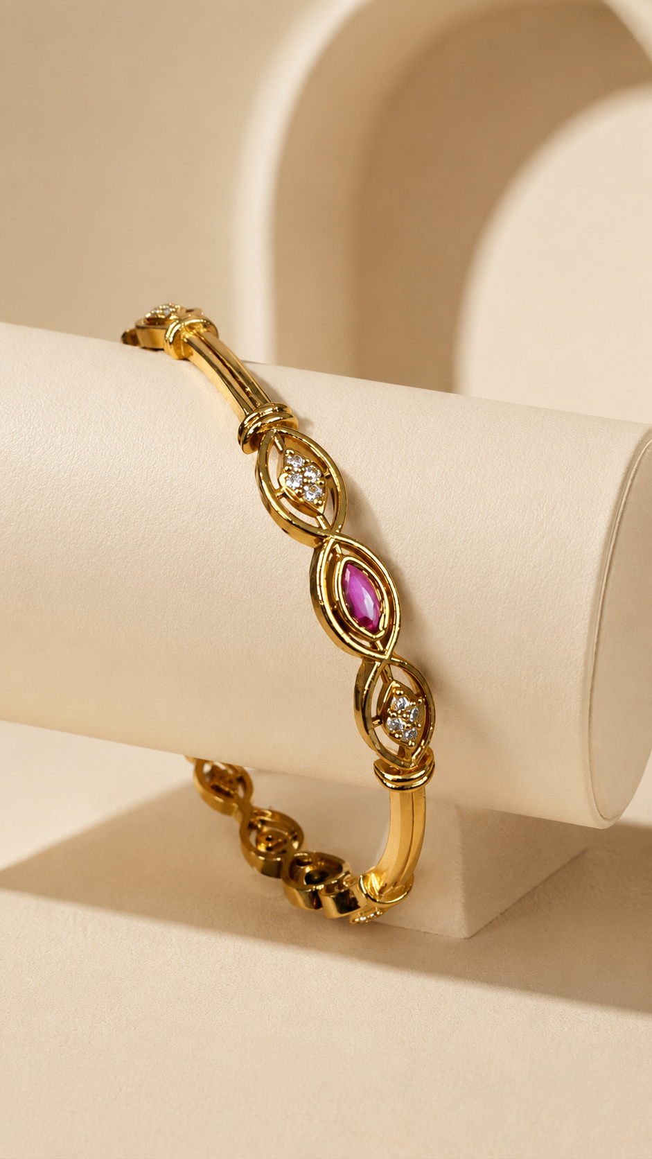 Close-up of Belumiee Ruby Marquise Crystal Gold-Tone Bangle showing intricate marquise-shaped crystal details.