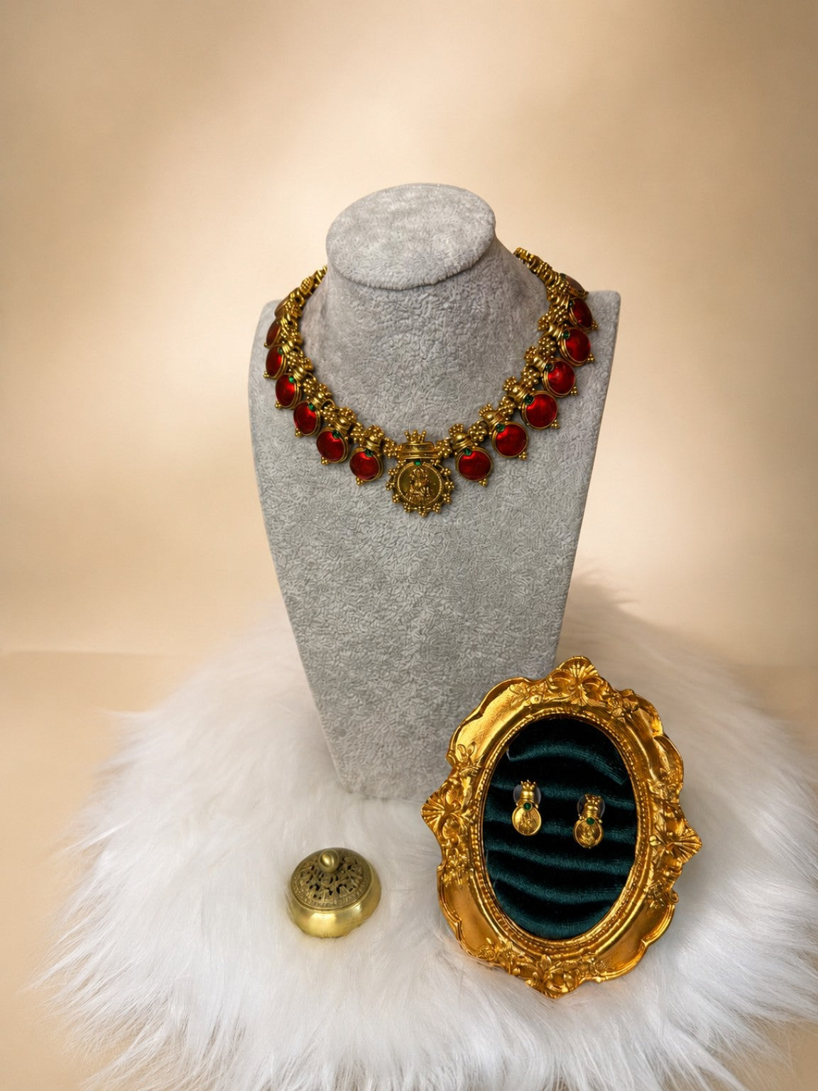 Traditional medallion stone necklace set with ruby-red medallion and matching earrings, crafted by Belumiee.