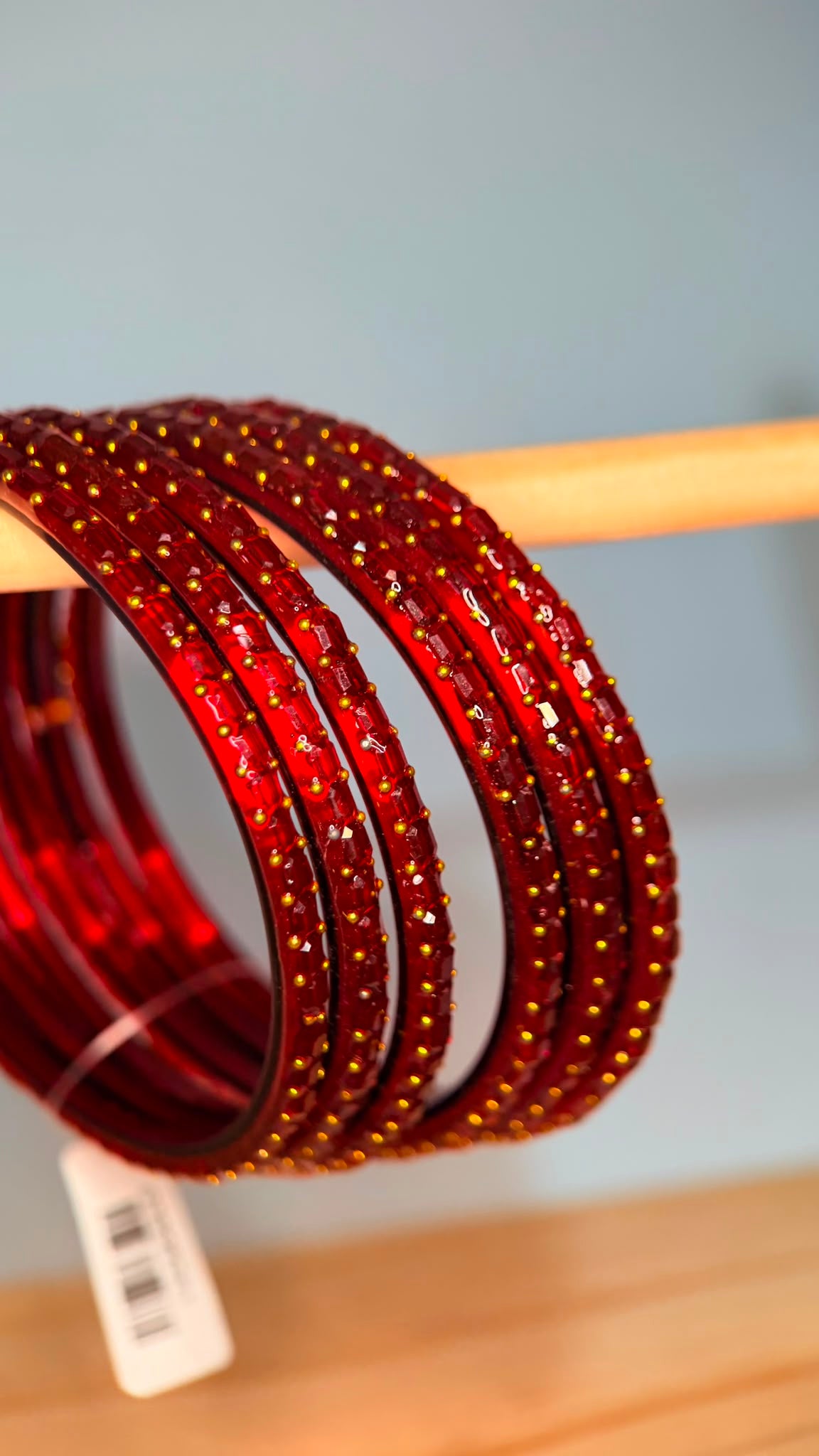 Belumiee Navrang Sparkle Glass Bangles Set with ruby red glass bangles, showcasing intricate sparkle and traditional design.