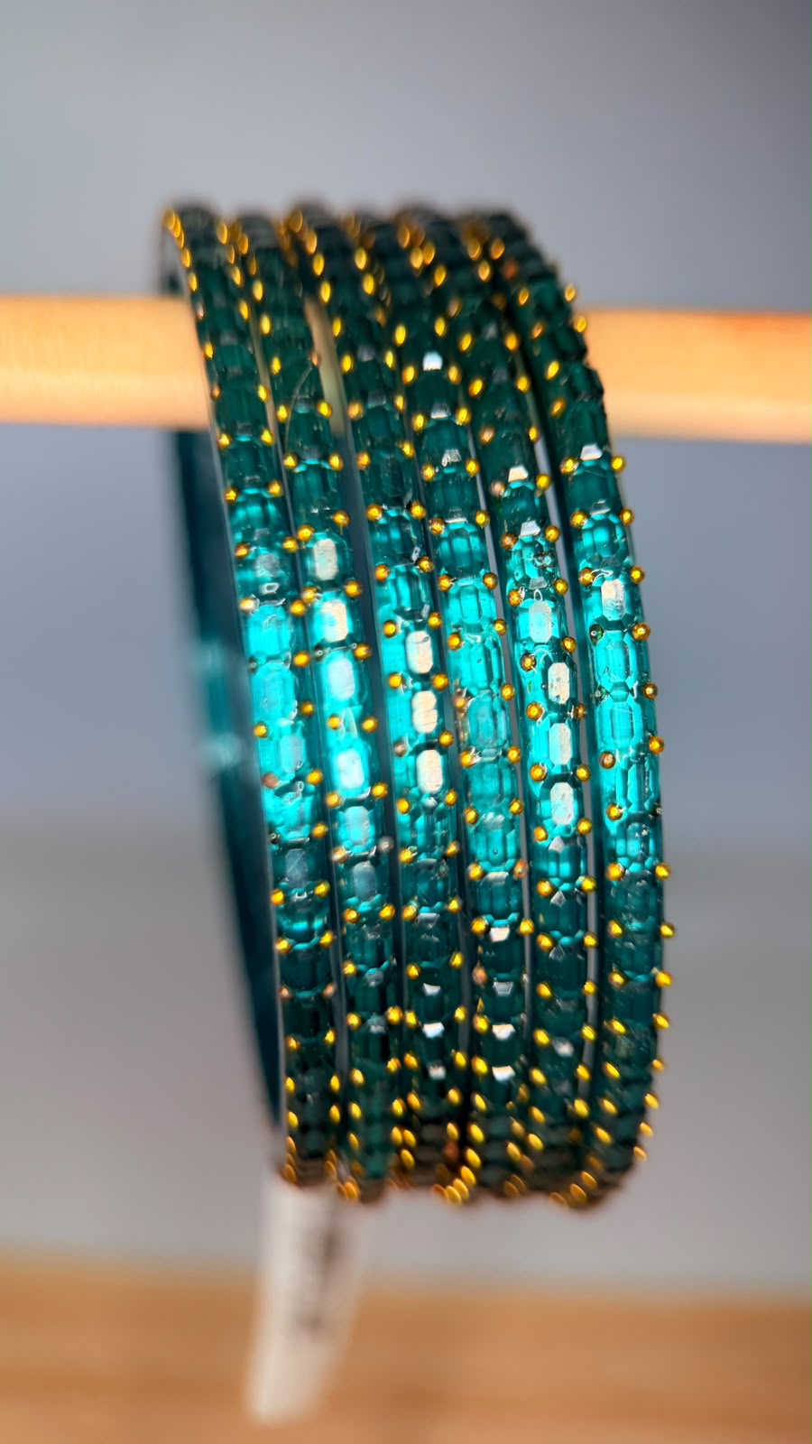 Teal blue Navrang Sparkle Glass Bangles Set by Belumiee, featuring shimmering glass bangles with intricate designs.