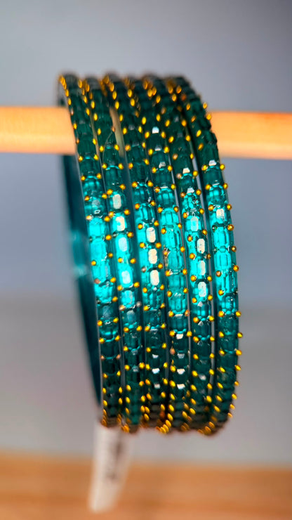 Teal blue Navrang Sparkle Glass Bangles Set by Belumiee, featuring shimmering glass bangles with intricate designs.
